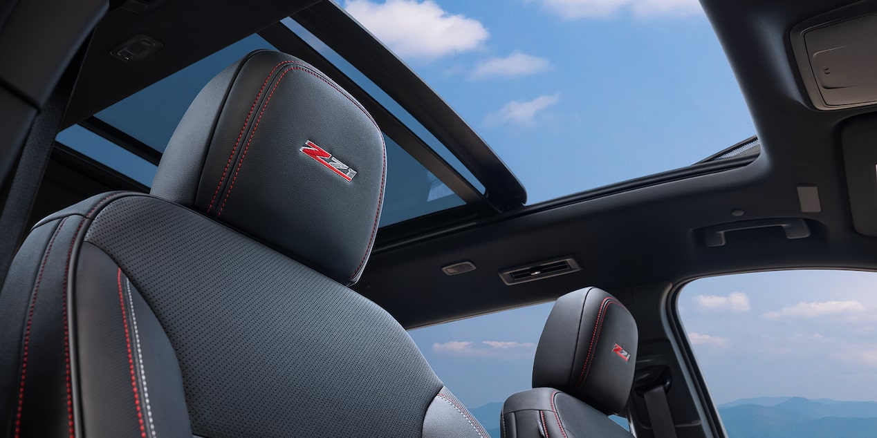 Front Passenger View of the Panoramic Sunroof Opened in a 2025 Chevy Traverse