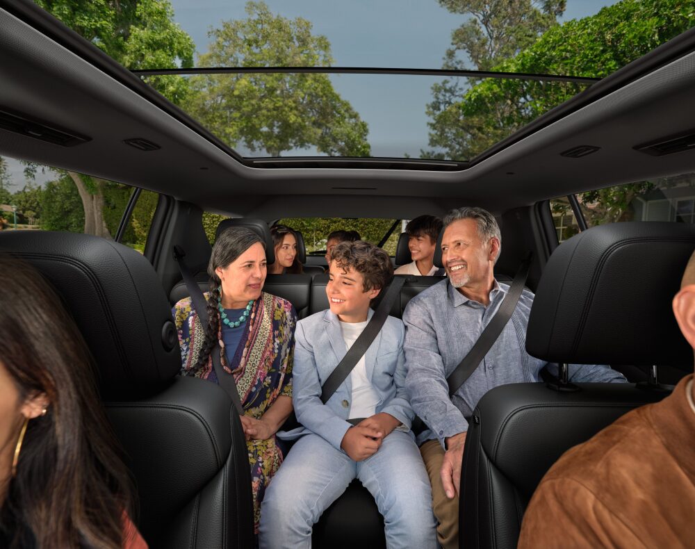 Front Interior View of a Family in Every Seat of the 2025 Chevy Traverse