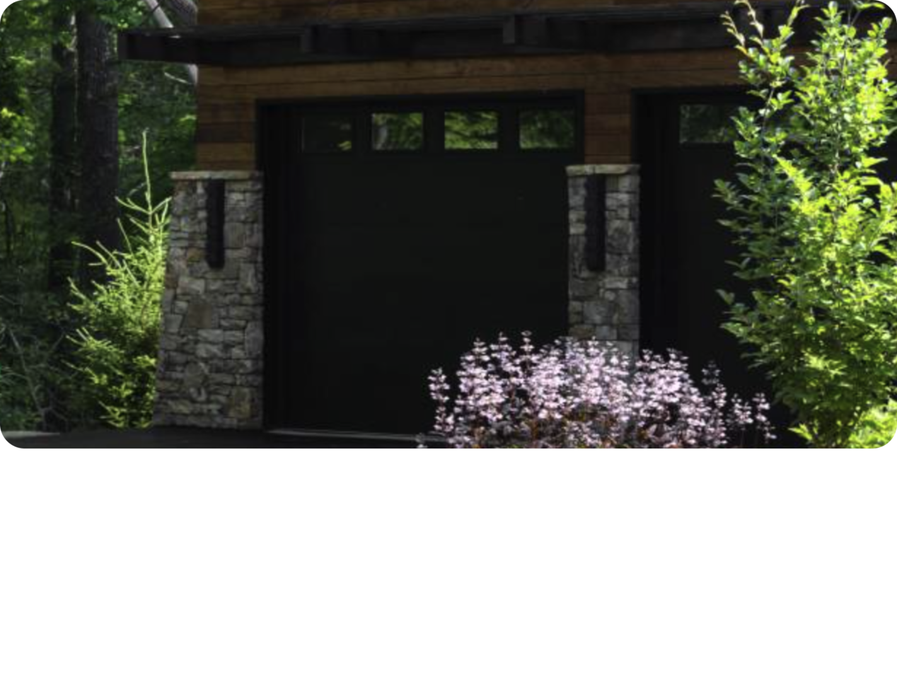 Three Quarters View of a 2025 Chevy Traverse with A Gargare Behind it