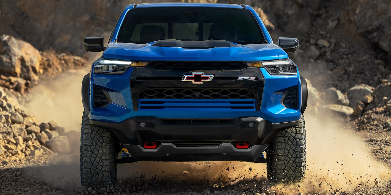 A Close up of the Front-End of the Chevy Colorado with a Mountain  Desert Background