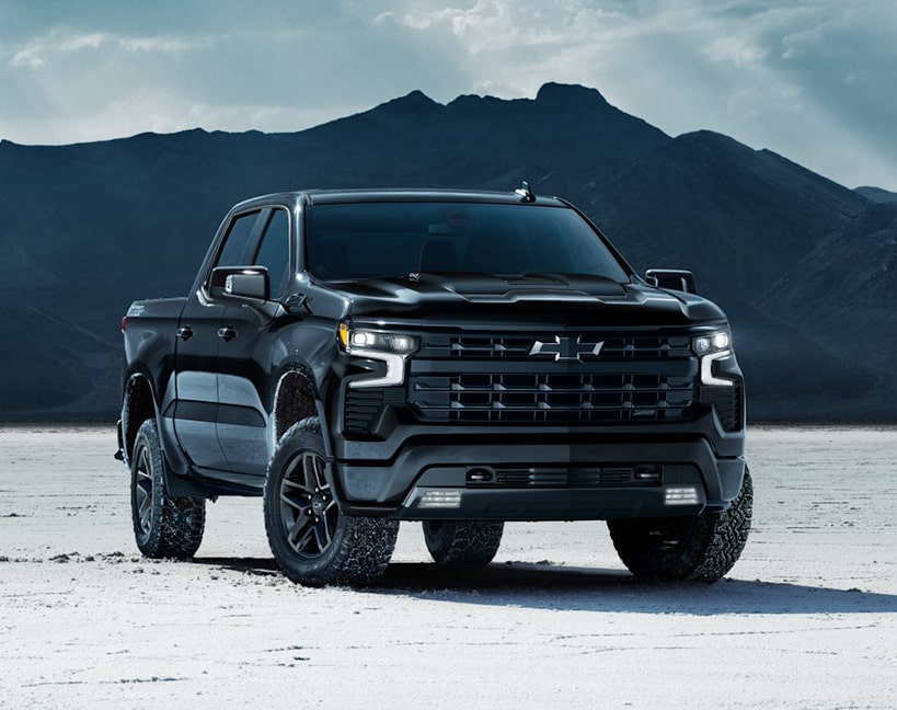 The 2025 Silverado Parked Near the Mountains on a Snow- Covered Ground