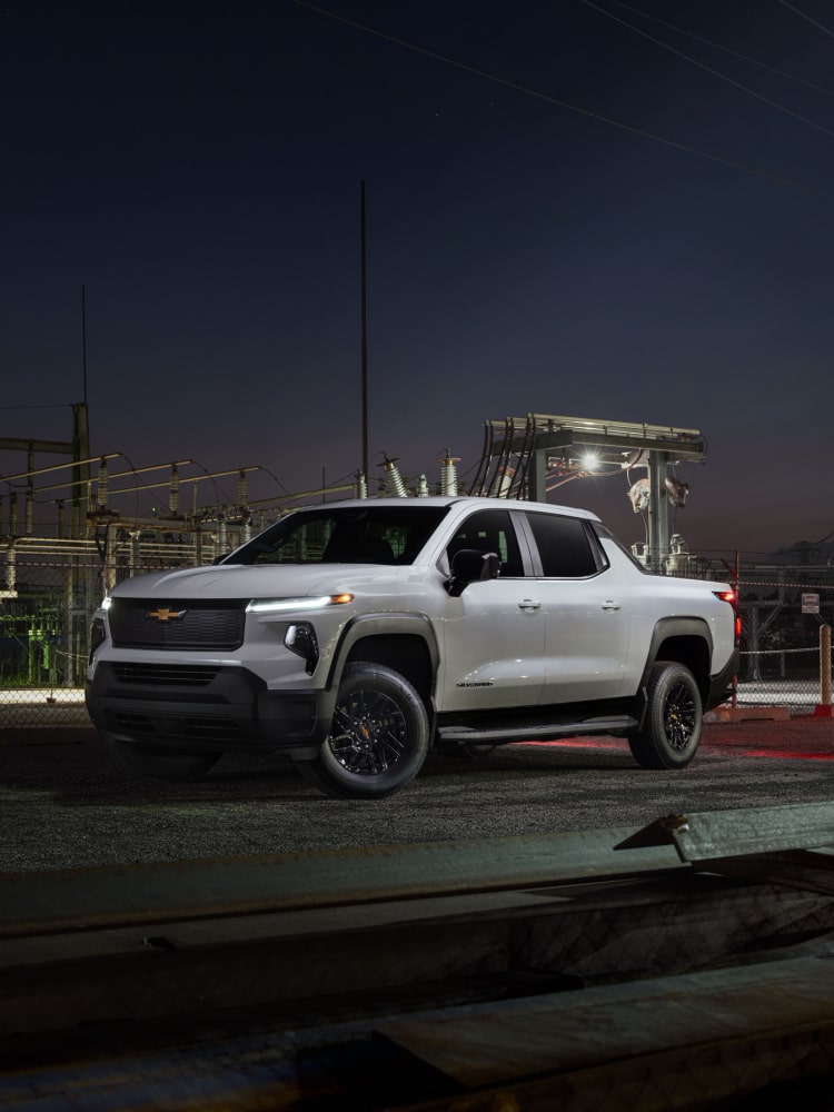 2026 Chevy Commercial Silverado EV Parked at a Construction Site at Night