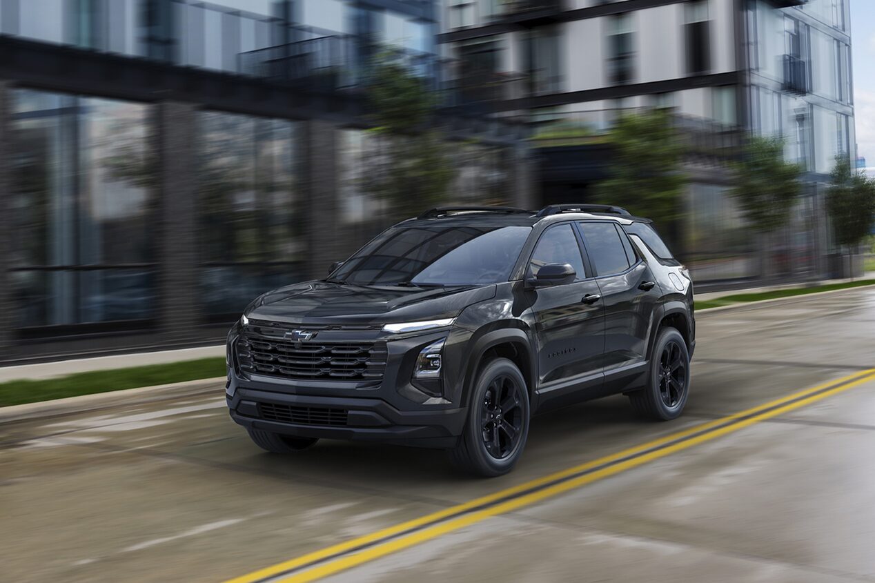 2026 Chevy Equinox Driving Through a Downtown Road