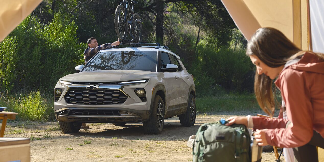 2026 Chevy Trailblazer Parked at a Campsite with a Bike Attached to the Roof Rack