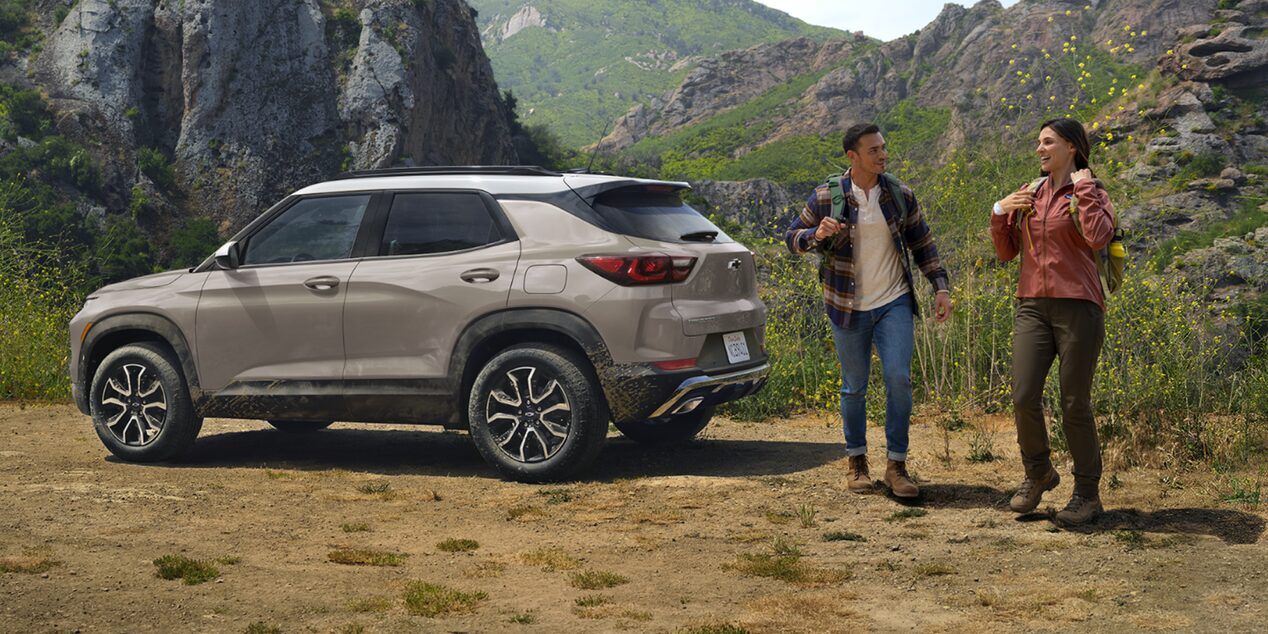 A Couple Hiking in the Mountains with Their 2026 Chevy Trailblazer