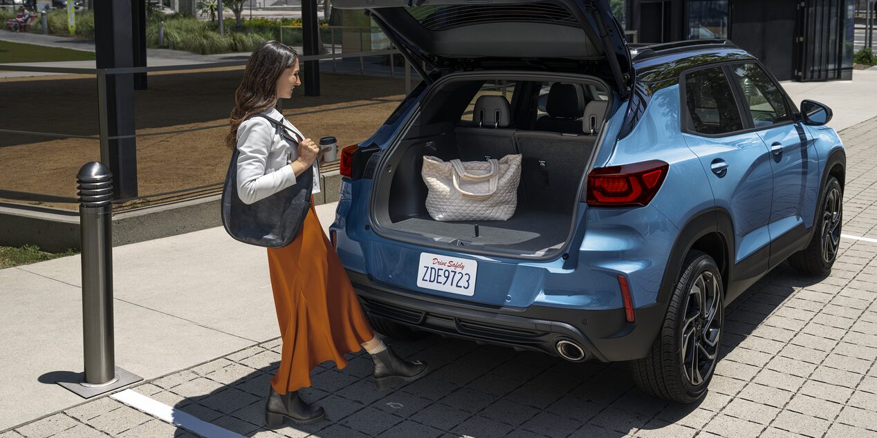 A Woman Loading Her Bag in the Trunk of the 2026 Chevy Trailblazer