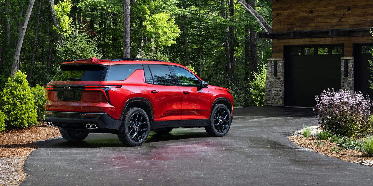 2026 Chevy Traverse Parked in the Driveway of a Cabin in the Woods