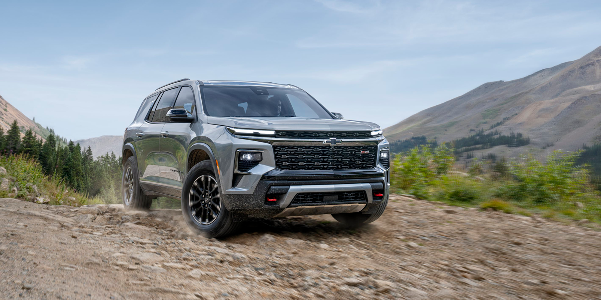 2026 Chevy Traverse Parked on a Dirt Trail in the Mountains