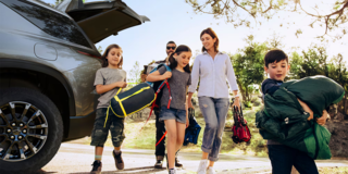 A Family Unloading Camping Gear From the Trunk of Their 2026 Chevy Traverse