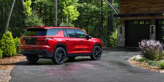2026 Chevy Traverse Parked in the Driveway of a Cabin in the Woods