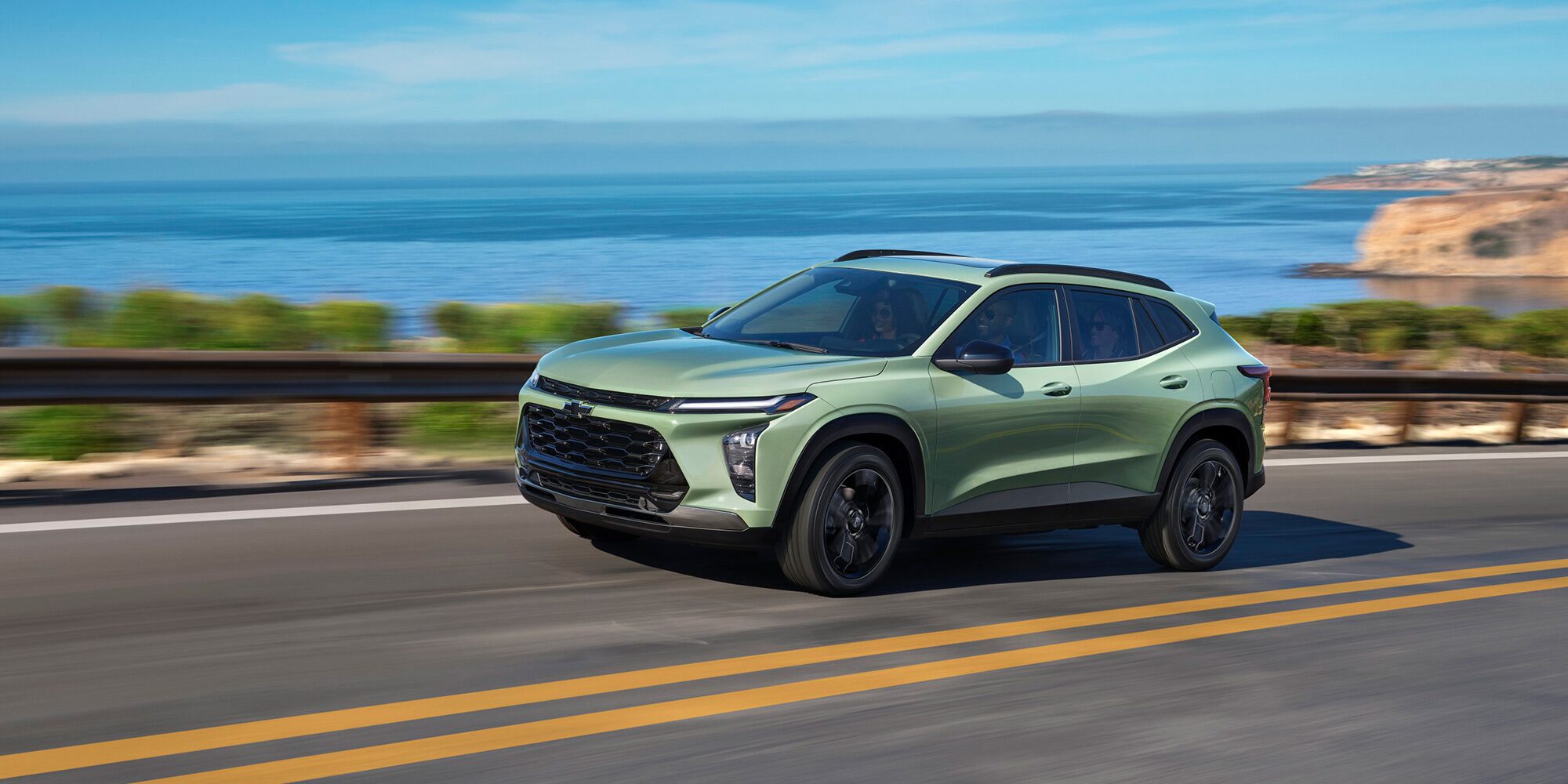 2026 Chevy Trax Speeding Over a Bridge Overlooking a Lake Below