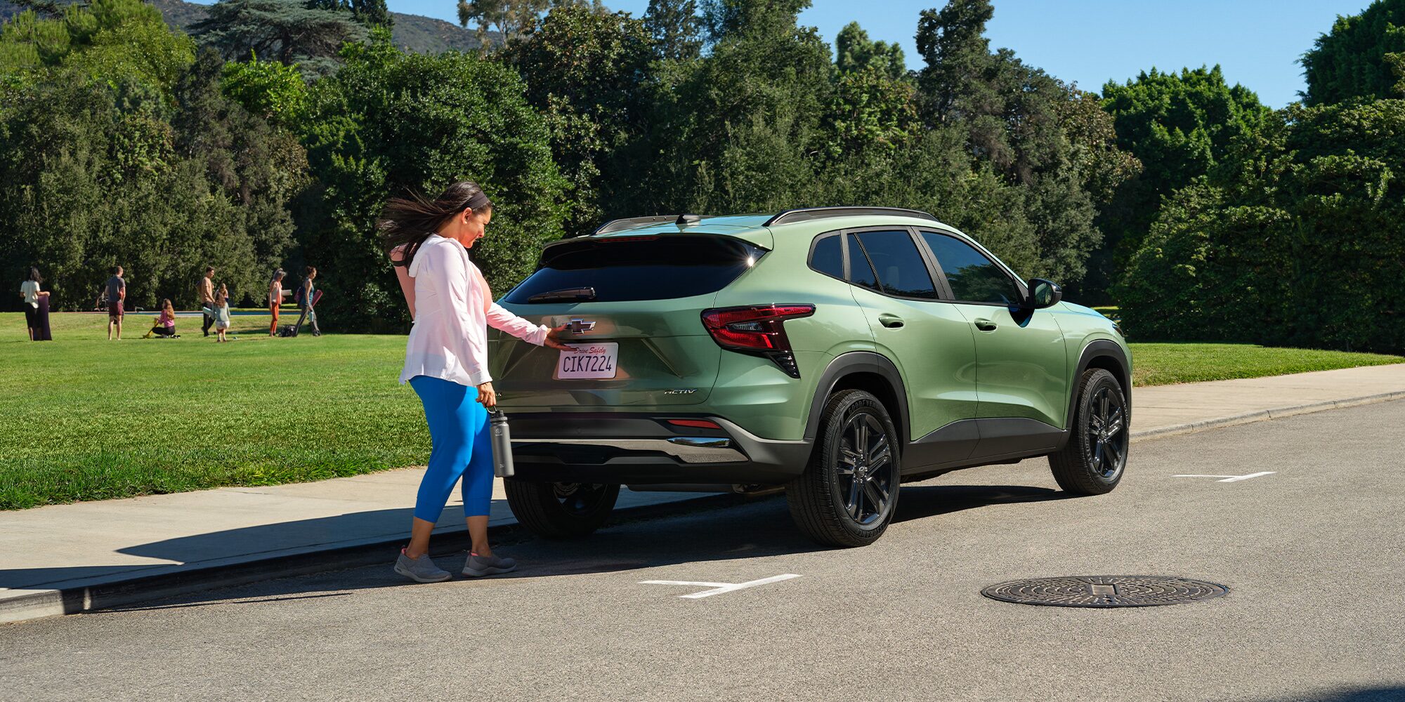 A Woman Opening Liftgate on Her 2026 Chevy Trax