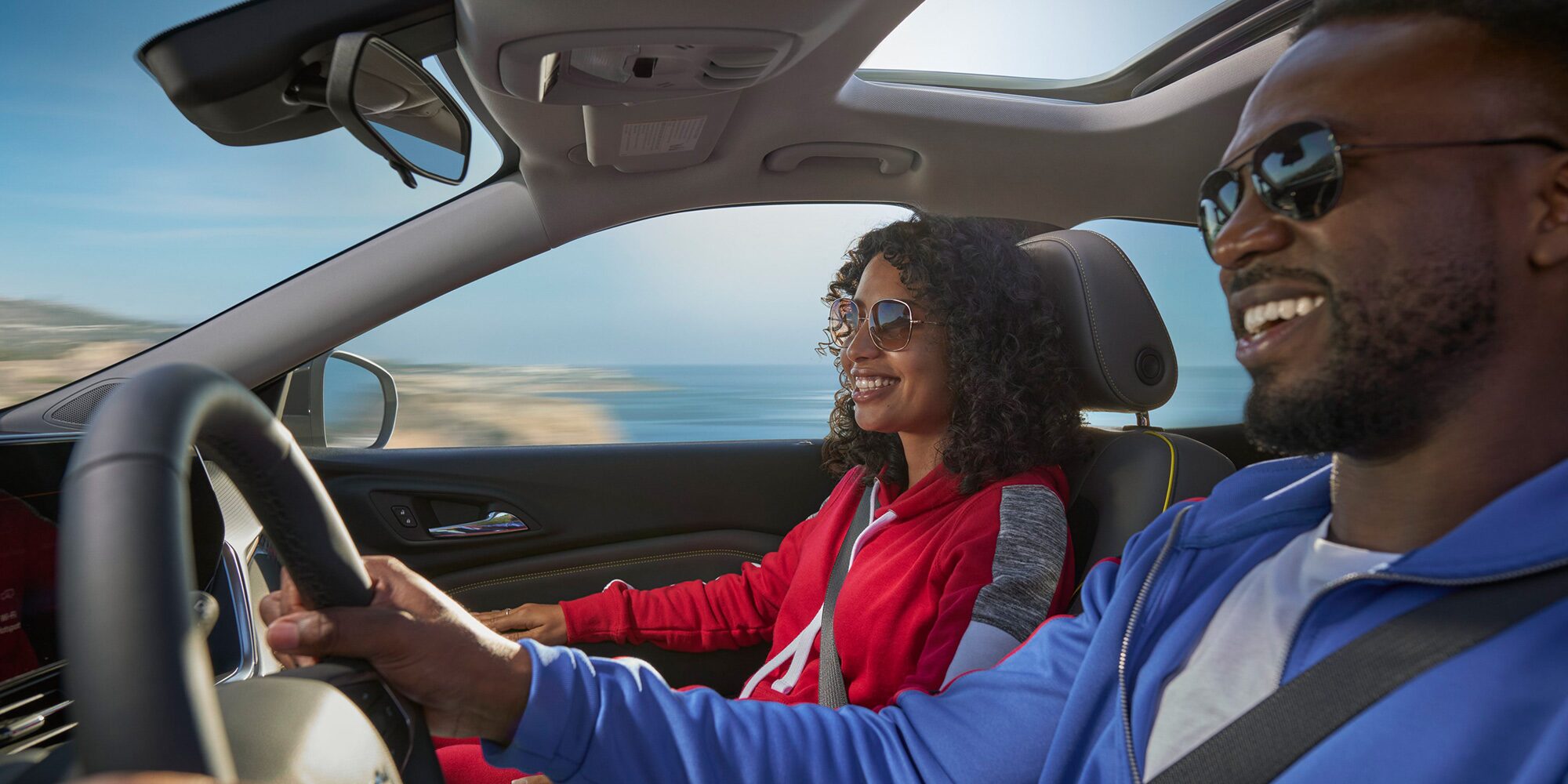 A Happy Couple Driving Their 2026 Chevy Trax