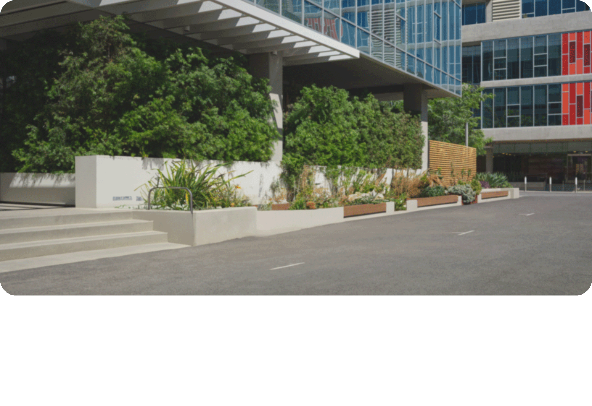 Front of a Building with Shrubbery