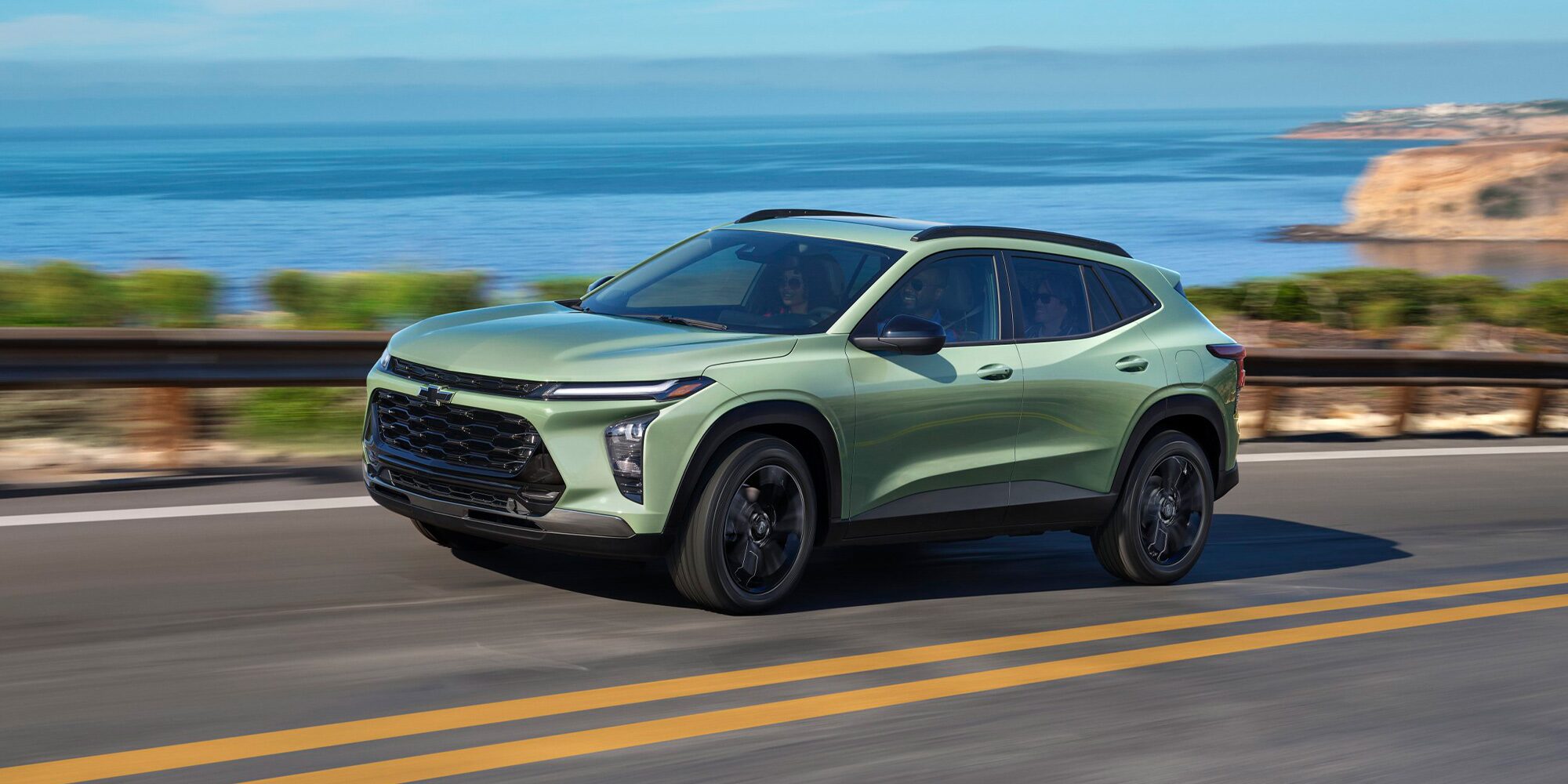 2026 Chevy Trax Speeding Over a Bridge Overlooking a Lake Below