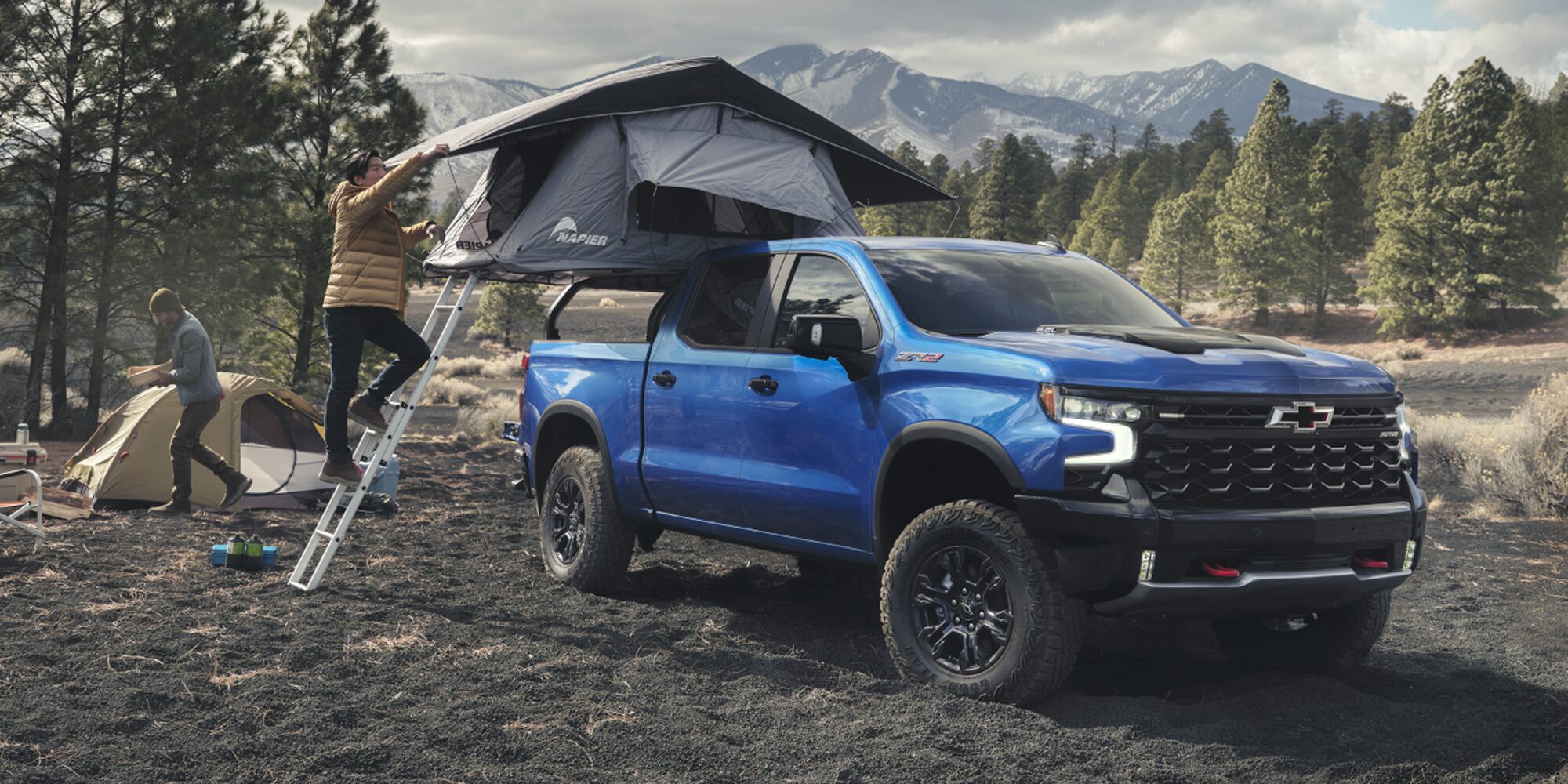 2026 Chevrolet Silverado LD Crew Cab ZR2 parked on a dirt terrain.