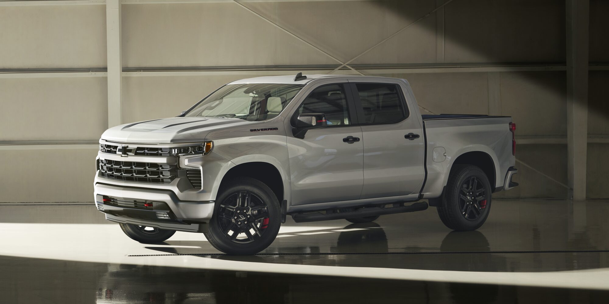 2026 Chevy Silverado Side Profile Parked in a Warehouse