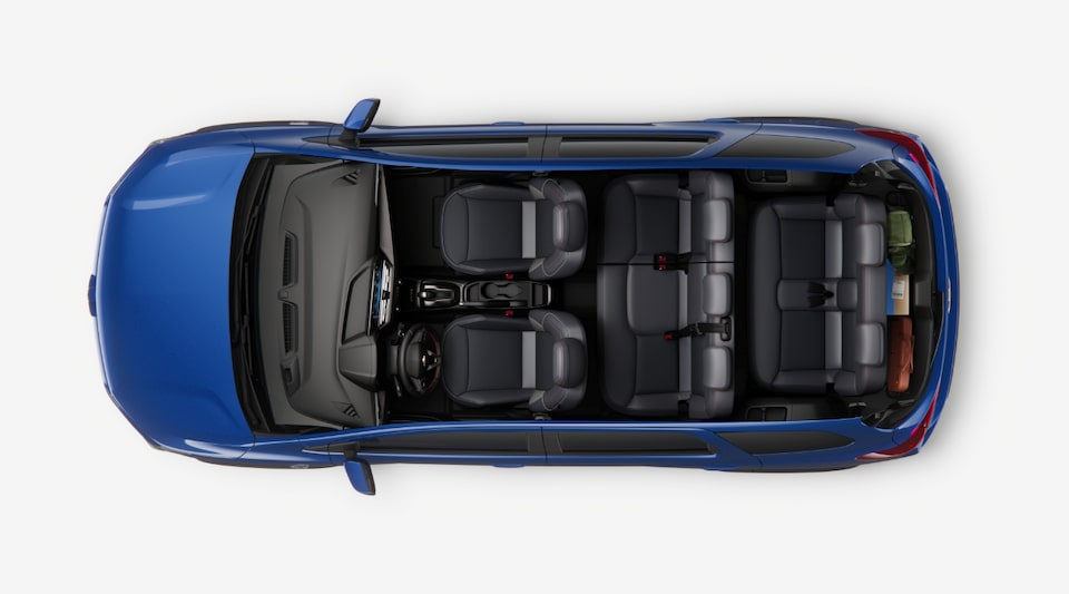 Imagem interna do novo Chevrolet Spin, com foco na versatilidade do espaço interno, mostrando todos os bancos levantados.