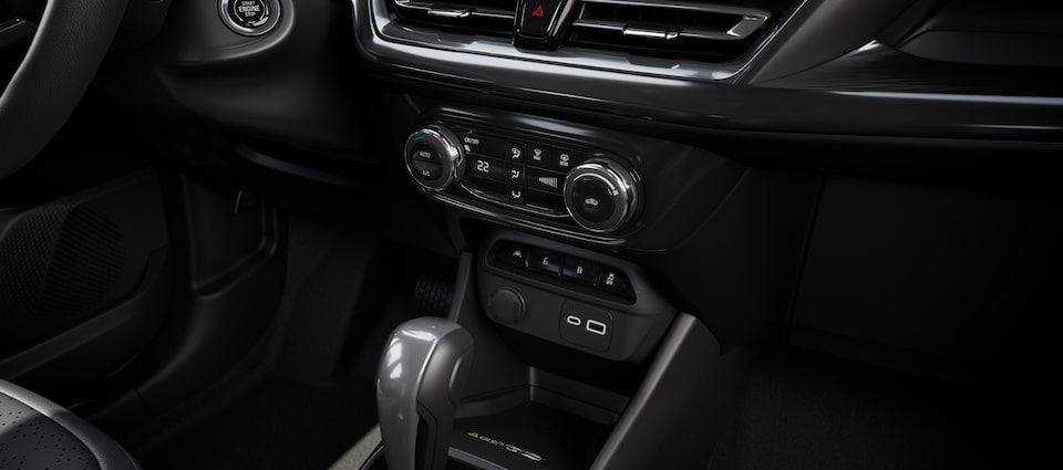 Imagem interna do novo Chevrolet Spin, com foco nos controles de ar-condicionado.