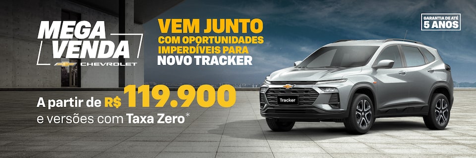 Banner promocional Mega Venda Chevrolet com Chevrolet Tracker prata visto de frente e lateral direita, estacionado em piso de concreto. À esquerda, texto em destaque: Vem junto com oportunidades imperdíveis para Novo Tracker – a partir de R$ 119.900 e versões com Taxa Zero. No canto superior direito, selo de garantia de até 5 anos.