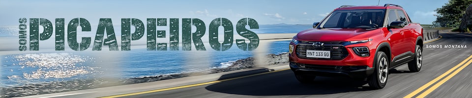 Propaganda da Chevrolet apresentando uma picape vermelha sobre fundo na estrada em direção à praia. O texto diz "Somos picapeiros".