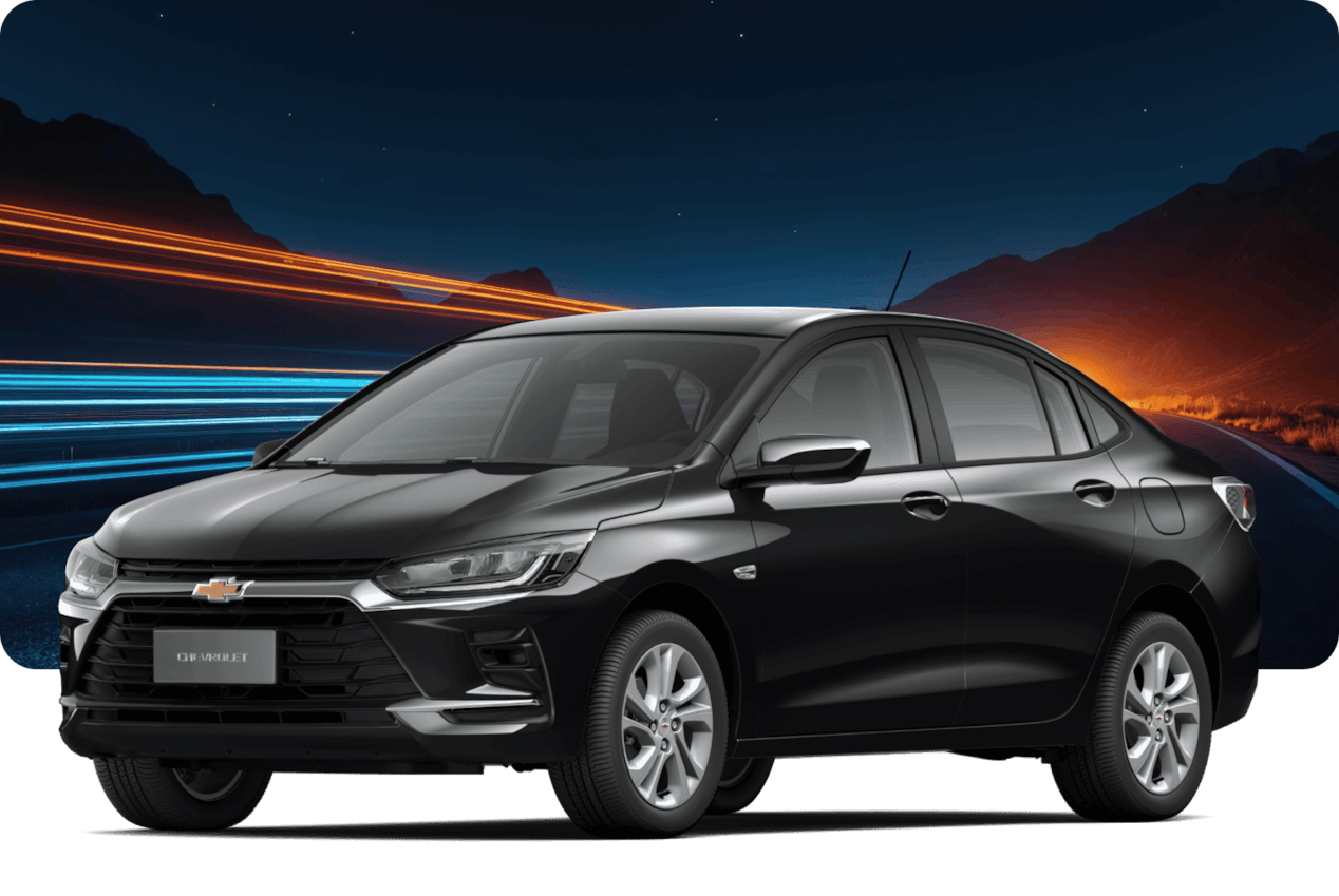 Chevrolet Onix LTZ Turbo AT na cor Preto Ouro Negro, com pôr do sol ao fundo.