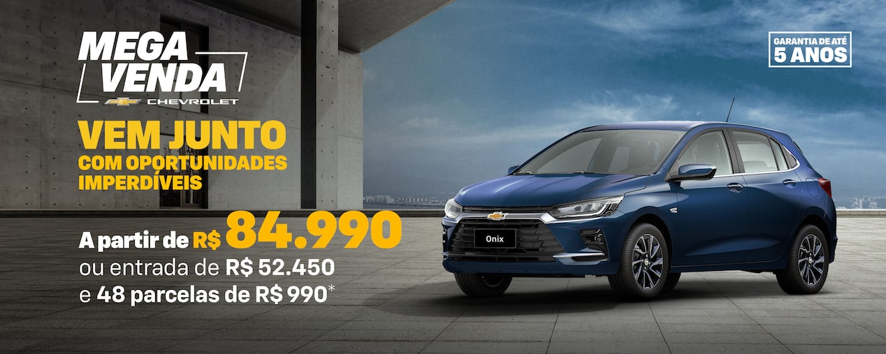 Banner promocional Mega Venda Chevrolet com Chevrolet Onix azul visto de frente e lateral direita, estacionado em piso de concreto. À esquerda, texto em destaque: Vem junto com oportunidades imperdíveis para Novo Onix – a partir de R$ 84.990 ou entrada de R$ 52.450 e 48 parcelas de R$ 990. No canto superior direito, selo de garantia de até 5 anos.