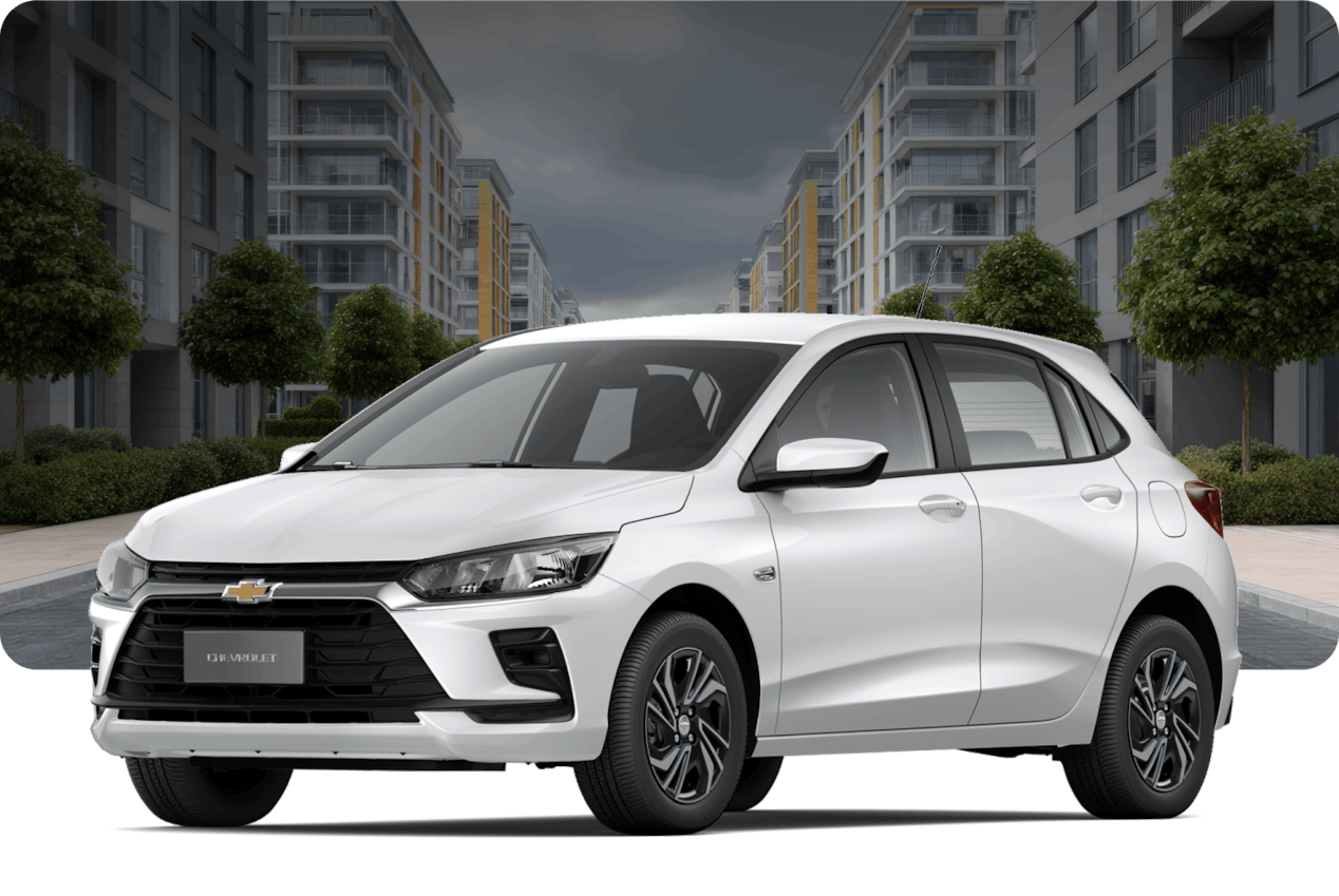 Chevrolet Onix MT na cor Branco Summit, em rua residencial moderna.