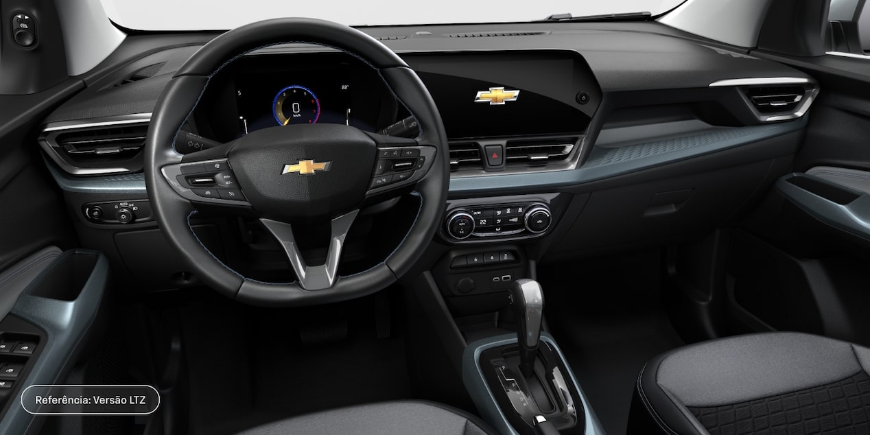 Visão em primeira pessoa do banco do motorista do Chevrolet Spin 2027 versão LTZ; vemos volante, painel, alavanca de câmbio e central multimídia MyLink.