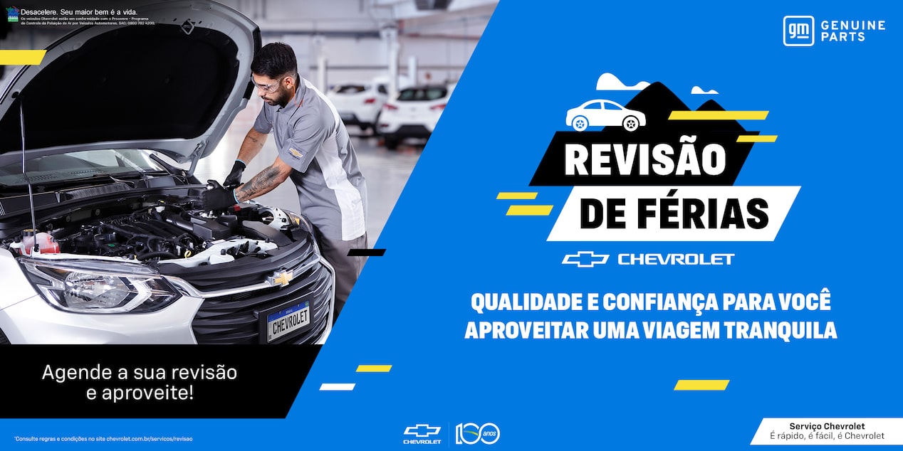 Banner da campanha “Revisão de Férias” da Chevrolet. À esquerda, mecânico inspeciona o motor de um carro em oficina. À direita, fundo azul com texto: “Qualidade e confiança para você aproveitar uma viagem tranquila”.