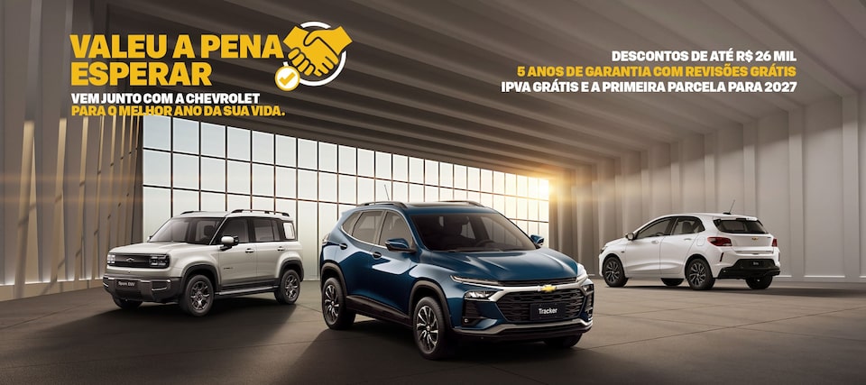 Banner com veículos Chevrolet - Spark EUV, Tracker e Onix- dispostos com composição triangular dentro do quadro. No quadrante superior esquerdo, o texto: Valeu a pena esperar, acompanhado de um ícone que representa um bom acordo (aperto de mão e um sinal de check); abaixo, o complemento: Vem junto com a Chevrolet para o melhor ano da sua vida. Mais abaixo, os CTAs Explore nossas ofertas e Encontre seu Chevrolet. No quadrante superior direito, os textos: descontos de até R$ 26 mil, 5 anos de garantia com revisões grátis e IPVA grátis e a primeira parcela para 2027