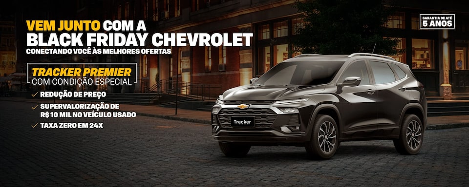 Banner da Black Friday com um Tracker estacionado em uma rua urbana à noite. O texto destaca Vem junto com a Black Friday Chevrolet, Tracker Premier com condição especial, além de benefícios como redução de preço, supervalorização de R$10 mil no veículo usado e taxa zero em 24x. Selo de garantia de até 5 anos.