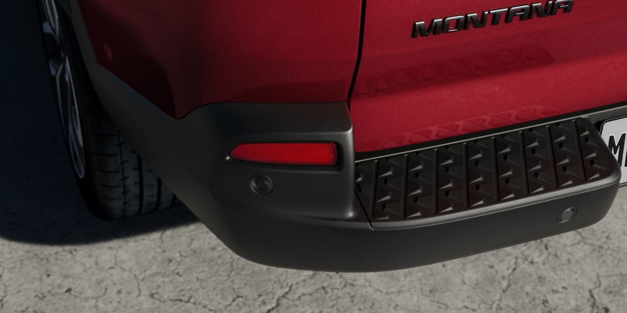 Detalhe do para-choque traseiro e sensor de estacionamento da Chevrolet Montana na cor Vermelho Scarlet