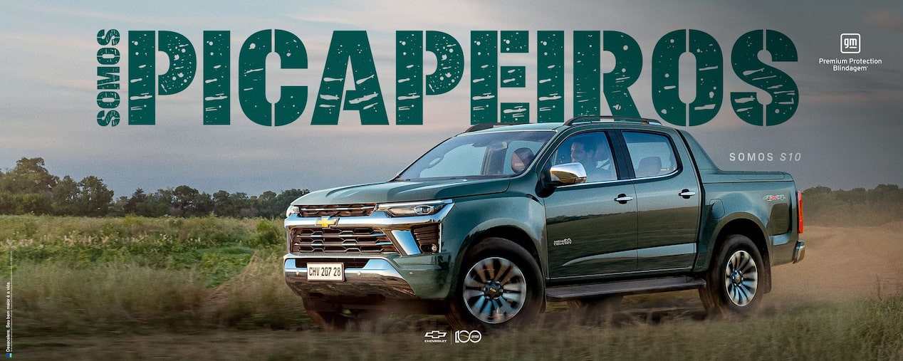Banner Somos Picapeiros com uma S10 High Country em movimento no campo. No canto superior direito, o selo GM – Premium Protection Blindagem.